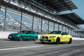 bmw m3 sedan e bmw m4 coupe paralelas em pista de corrida