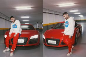 kevinho posando em frente ao seu audi r8 vermelho