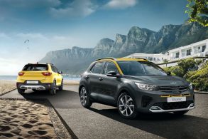 kia stonic cinza frente amarelo traseira estrada