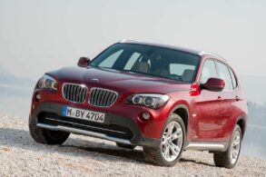 bmw x1 xdrive28i 2010 vermelho frente e lateral