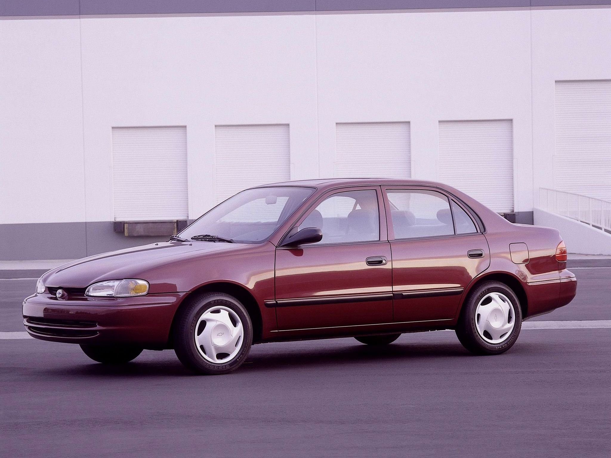 chevrolet prizm vinho frente parado