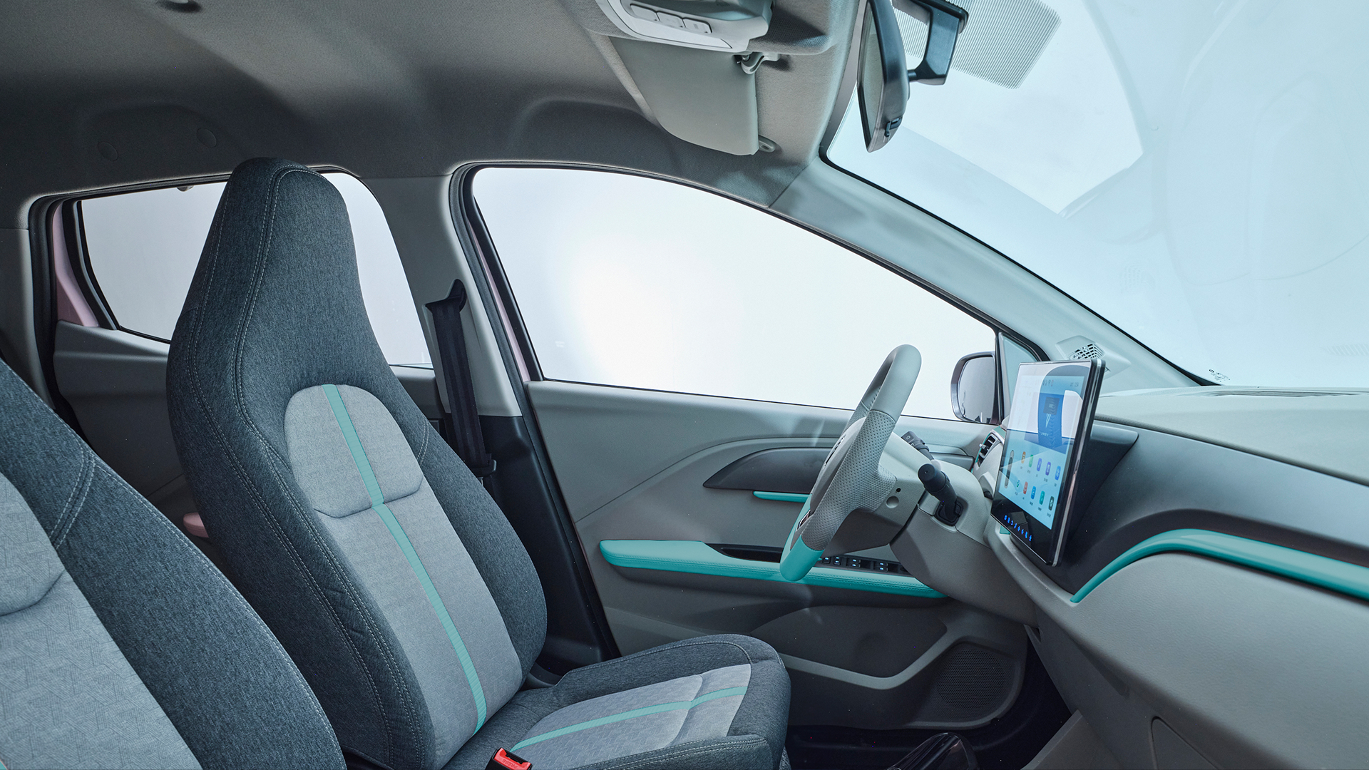 JMEV EV3 carro de autoescola elétrico com câmbio manual interior em cinza com detalhes azuis