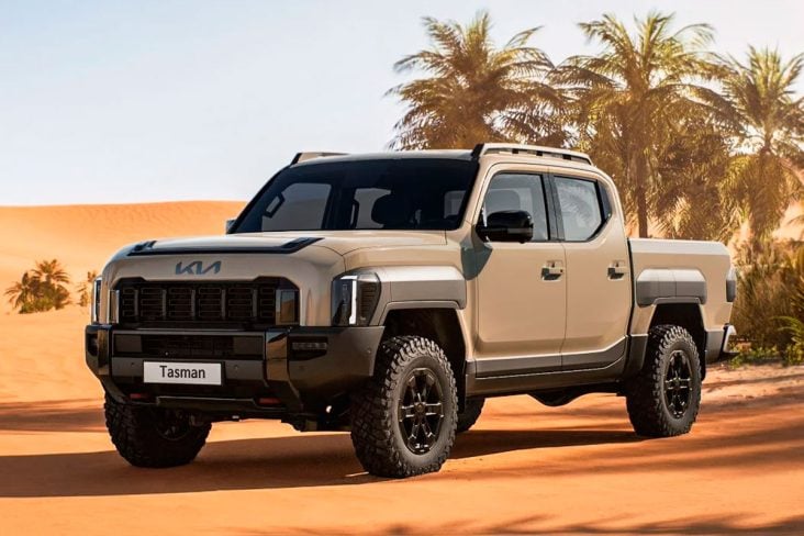 kia tasman x pro cabine dupla bege frente parada em oásis no deserto.