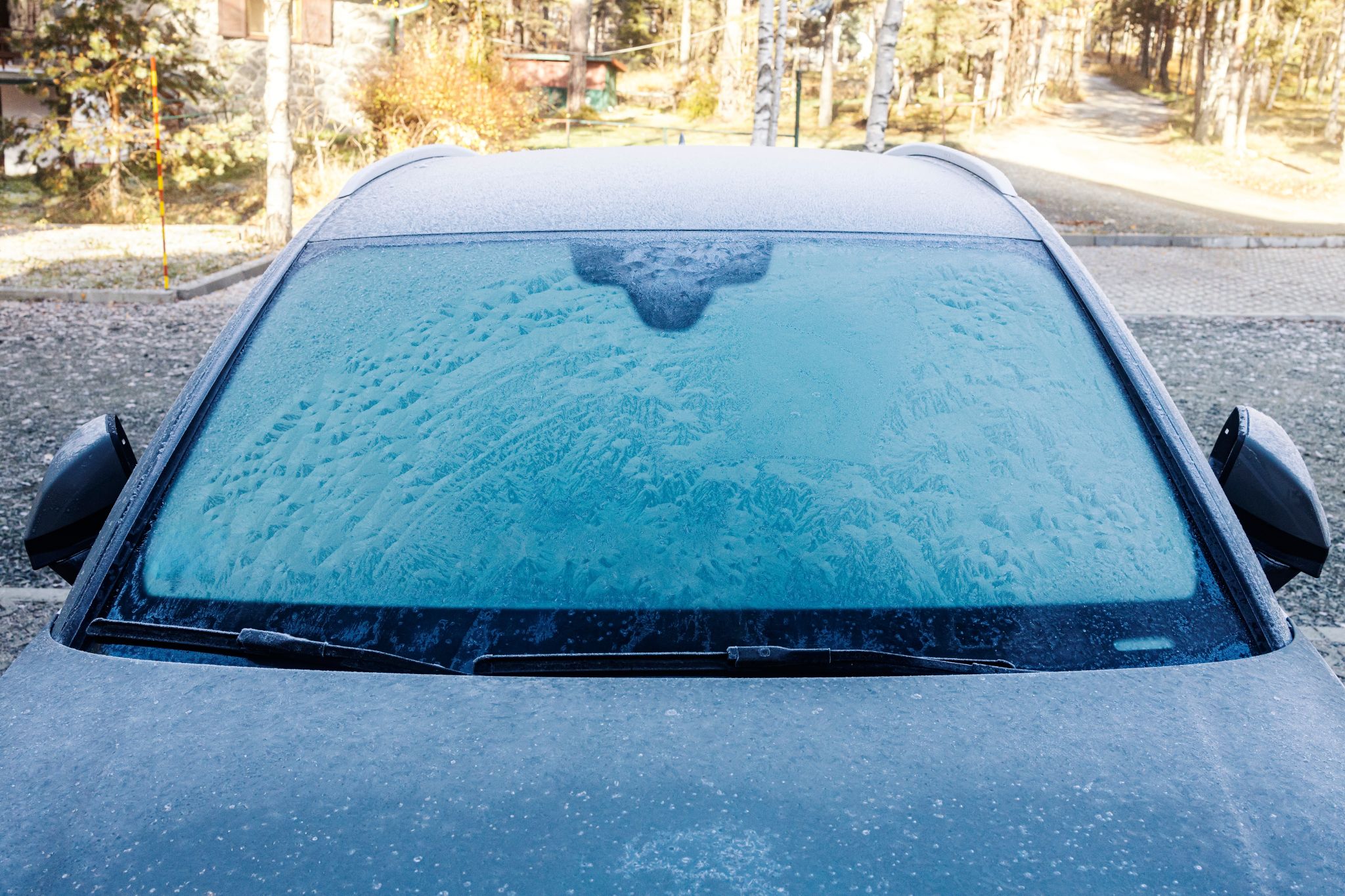 Front,View,Of,A,Car,Windshield,Covered,With,Ice,And