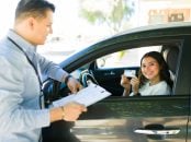 Portrait,Of,A,Cheerful,Teen,Girl,Showing,Her,Driver's,License