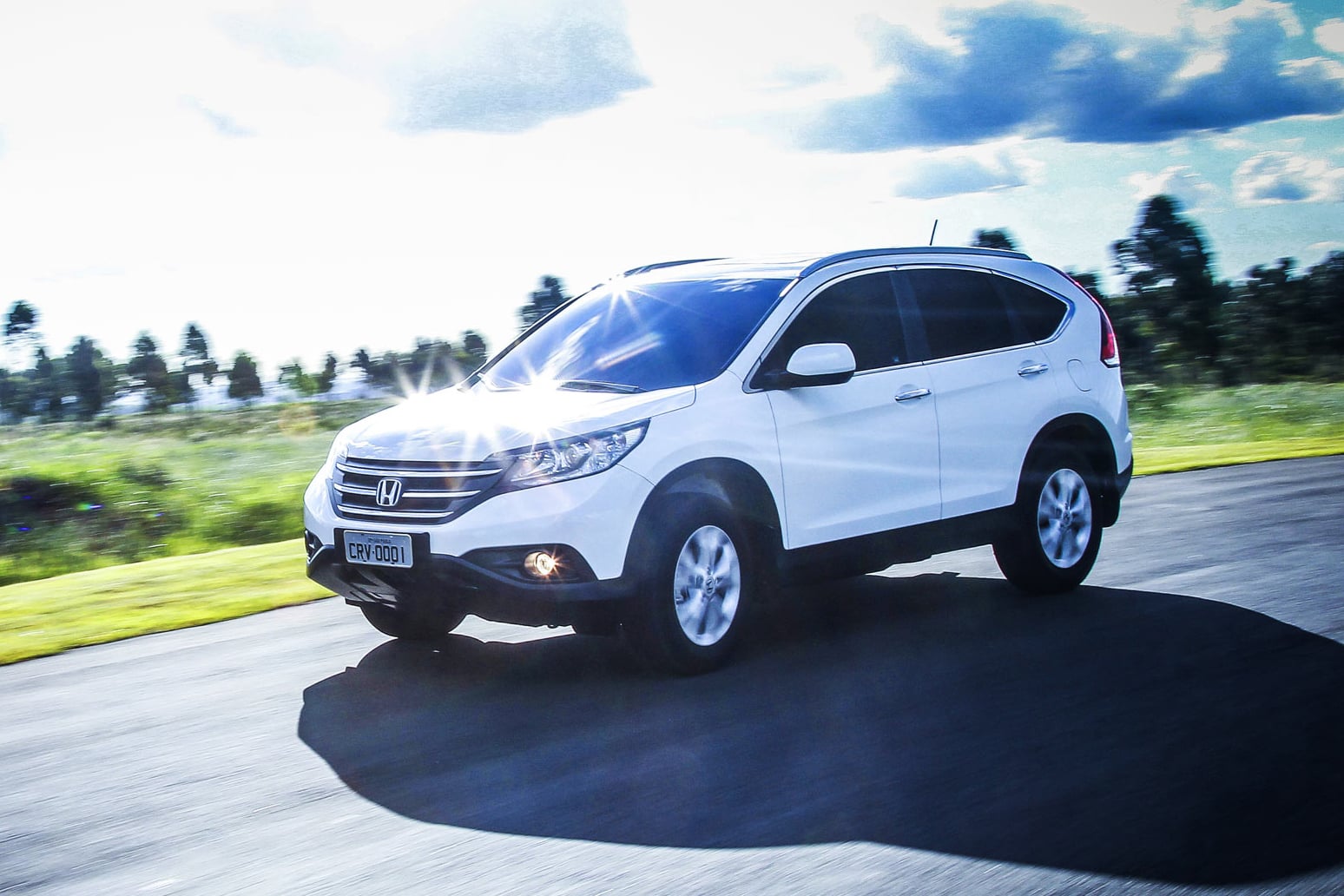 Honda CR V EXL 4WD 2012 branco frente em movimento