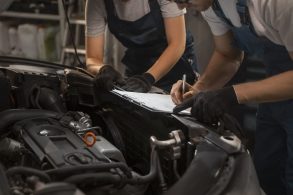 male female mechanics working shop car